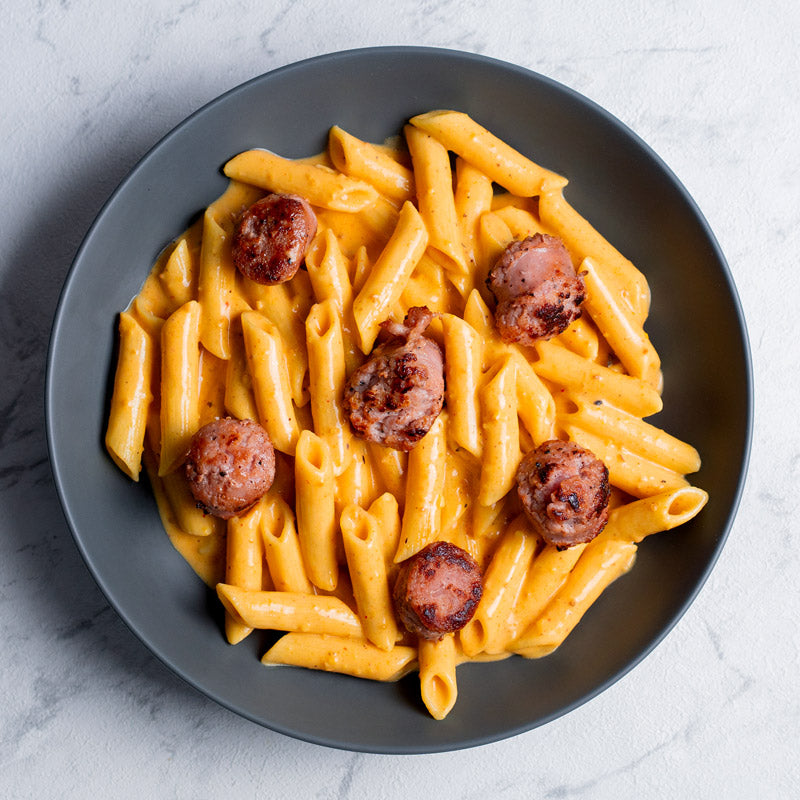 Penne rigate al romescu con longaniza catalana
