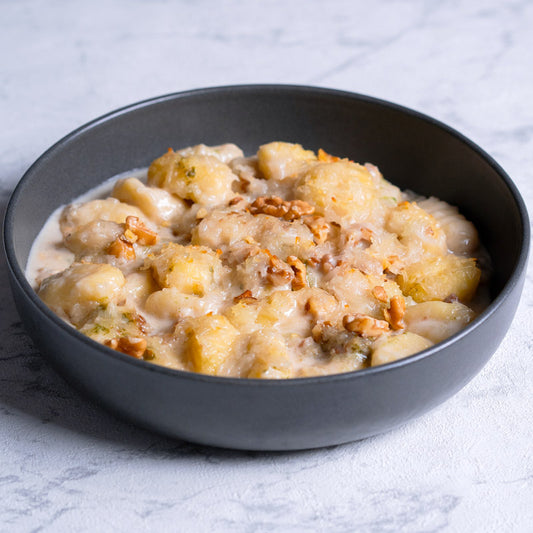 Gnocchi gratinados con salsa gorgonzola y nueces